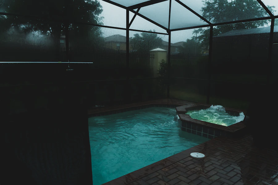 Screened pool enclosure during a heavy rain shower