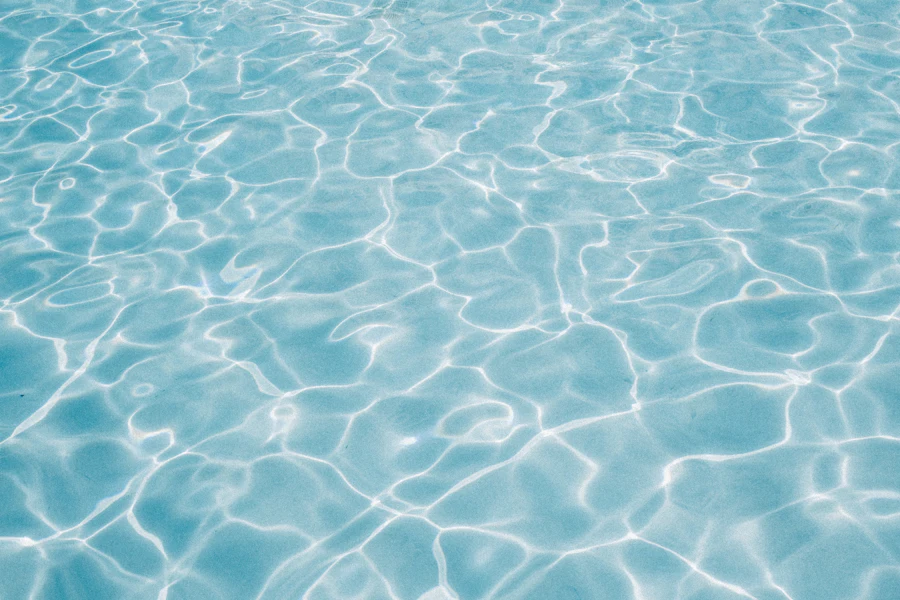 Ripples across clear light-blue pool water